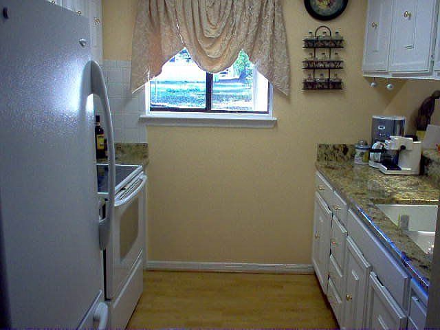 Kitchen with upgraded appliances and granite countertops