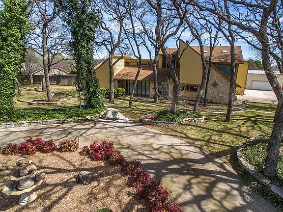Tree shaded, landscaped, circular drive.