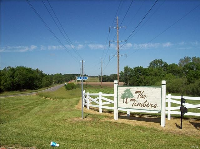 "The Timbers" is a subdivision with a lake, paved roads and beautiful wooded lots ready for your new home to be built.