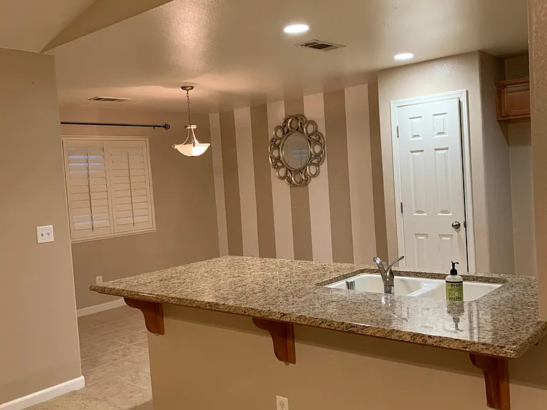 Beautiful granite tops in kitchen and dining room view.