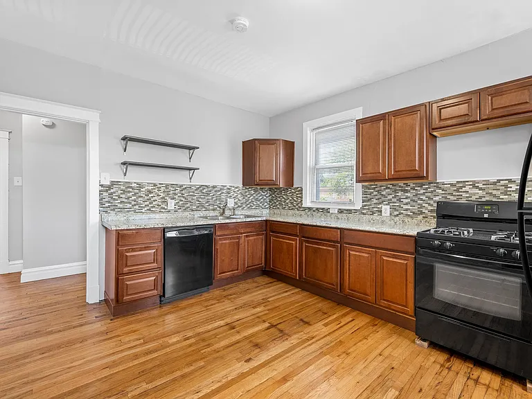 Mosaic tile backsplash
Wood cabinets