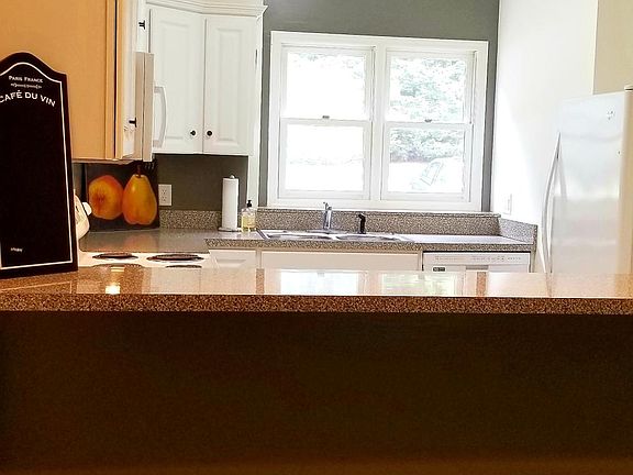 Open White Kitchen/Bar Counter Area