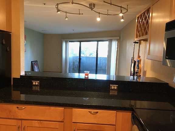Kitchen looknig out over Bar Counter to the living room