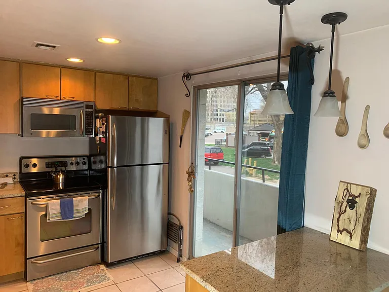 Here is the kitchen with a great big slider onto the deck.