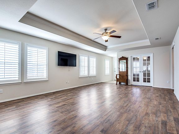 Living room with doors leading to the office