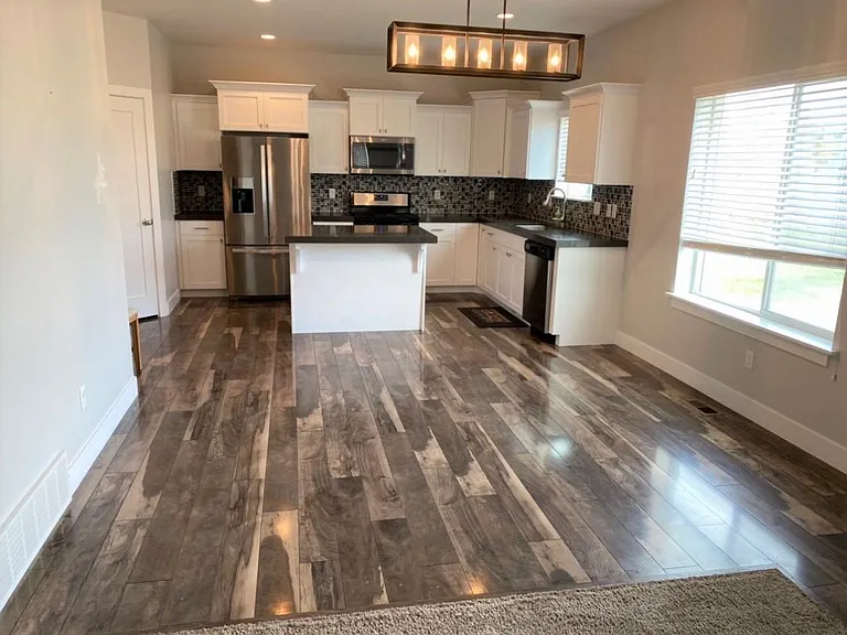 Kitchen / dining: Refrigerator stays.