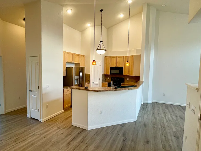 Living room/kitchen and entrance to 2nd bedroom