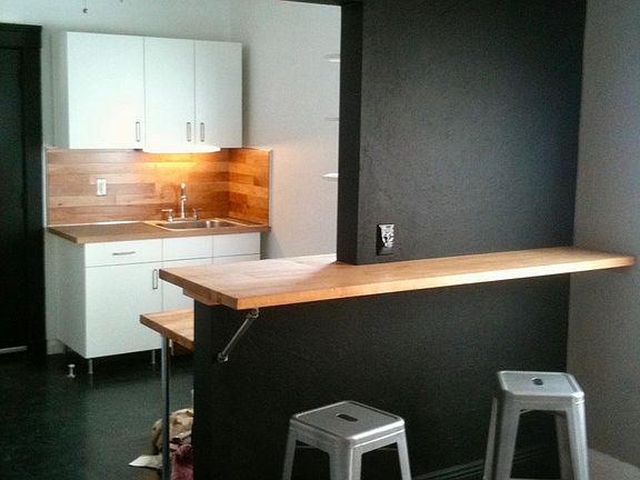 Bar-top view from living room to kitchen sink
