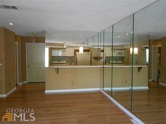 Open living area with view to kitchen.