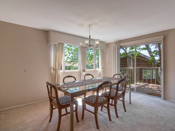 Formal dining room with slider to deck. Pefect for your dinner parties.
