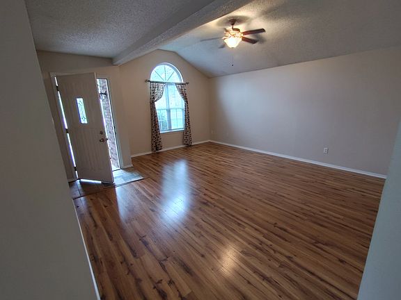 front room 18X16, cathedral ceiling, arch window.