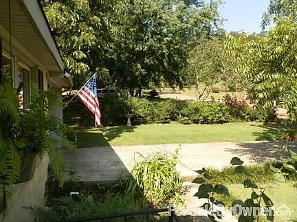 View of property from front door
						:
						Flag is shown at entrance to carport