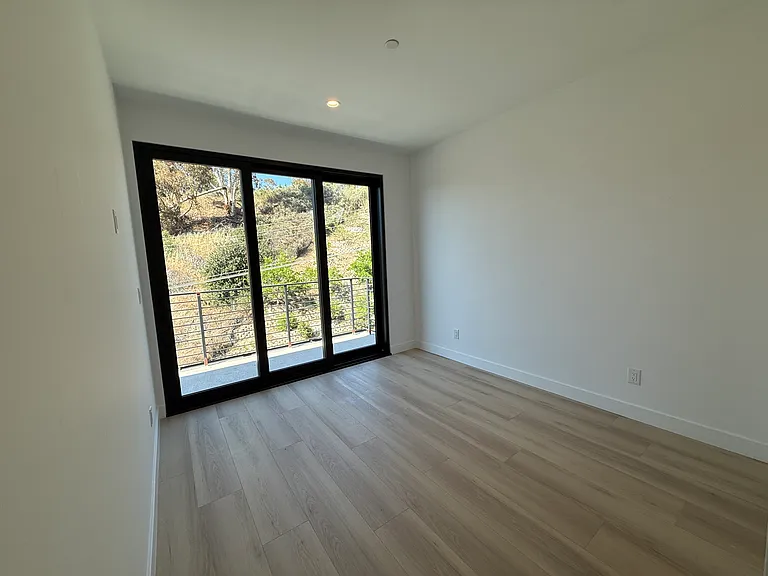 Upstairs bedroom 2 with shared balcony