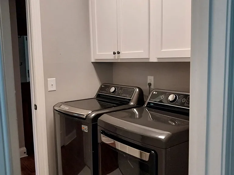 Laundry adjacent to Kitchen and Master Bath. Almost new LG W/D
