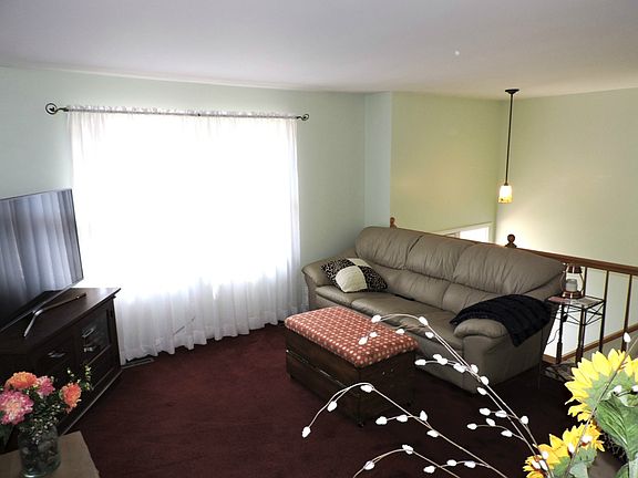 Living room window faces south for lots of natural daylight.