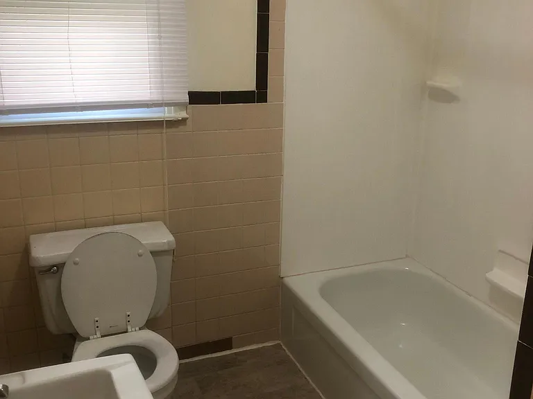 Bathroom. Tub with shower.