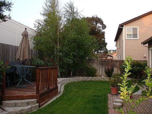 Brick patio and Rdwd Deck make for great backyard dining
