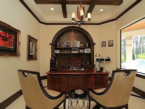 AND THE KING, WHO DESERVES NO LESS THAN HER MAJESTY, ALSO HAVE HIS FORMAL STUDY EXCLUSIVELY DESIGNED, WITH WOOD BUILT IN SHELVES, CROWN MOULDING, WOOD BASE BOARDS, EXPOSED WOOD BEAMS AND A BEAUTIFUL WINDOW THAT OVERLOOKS THE POOL AND BACK OF HOUSE.