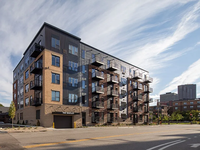 Full outside exterior view of The Whitley apartment building.