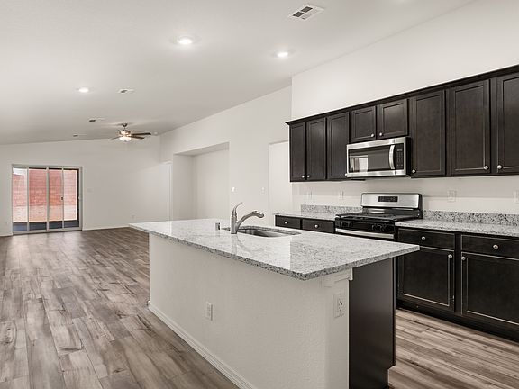 The kitchen is attached to the family room