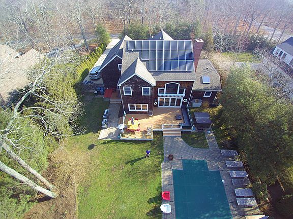 House faces wooded Perserve