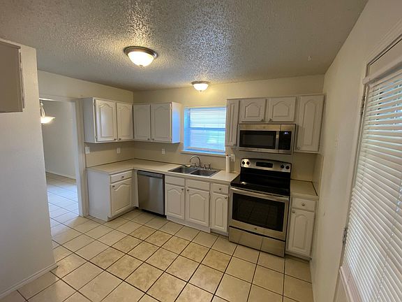 Kitchen with stainless steel appliances
