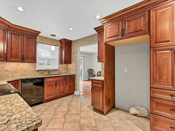 Stacked Cabinet Pantry, Over refrigerator storage cabinet, water line for ice maker and 2" Bali Wood Blinds.