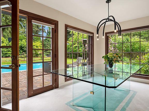 Dining room w/ views of yard and pool