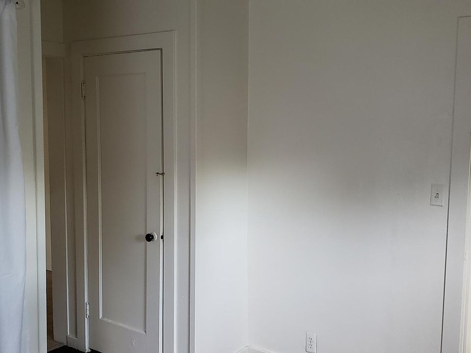 Bathroom located off entry, separate from bedroom/living area.