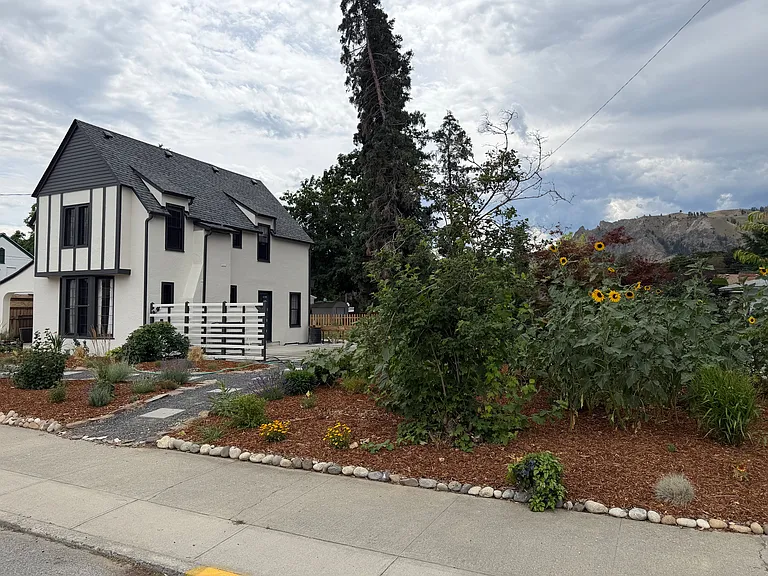 Yard is landscaped with native plants with walking paths and plenty of place to hang out.