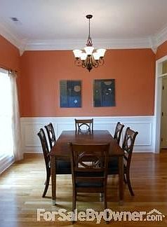 Dining Room : Double windows overlooking front garden / Paneled Wall