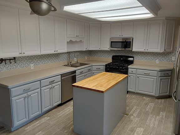 Kitchen new countertop and butcher block plus gas stove