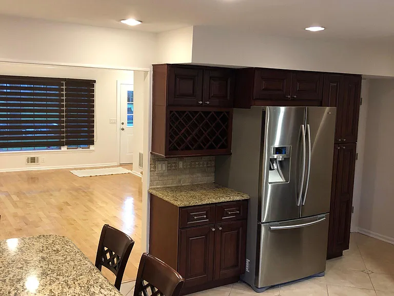 Bright dining area adjacent to kitchen and deck access.