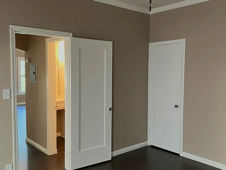 Bedroom looking into vanity area & Living Room