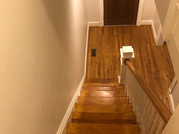 view of entry foyer from top of stairs