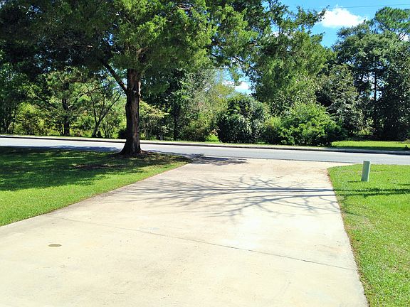 View of driveway from garage, looking towards road