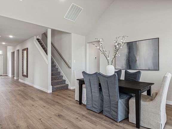 Dining room in the Wimbledon home plan by Trophy Signature Homes - REPRESENTATIVE PHOTO