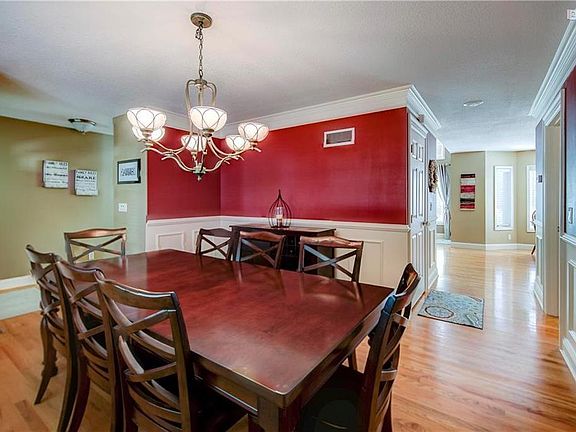 Open floor plan and gleaming hardwoods. Newly painted dining room and room for that next special meal with family and friends.