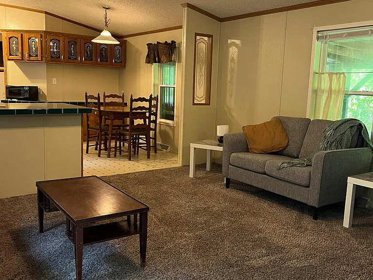 Currently a twin bed is in the living room with both couches.