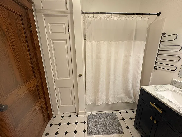 Primary bathroom, that floor is heated. You will thank us in the winter. Fully renovated.