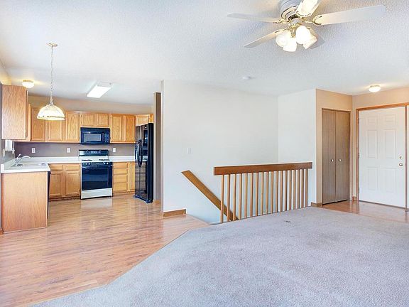 Large living room w open floor plan to kitchen and breakfast nook