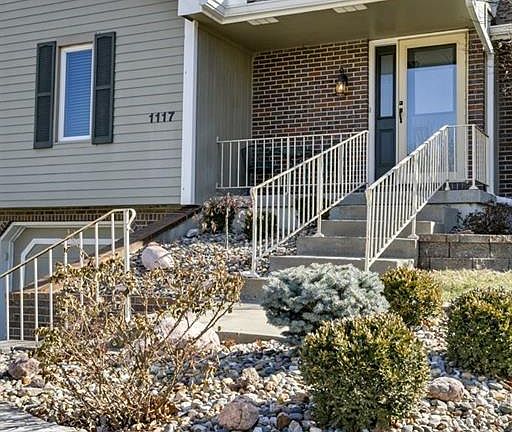 Stunning rock walls and landscaping, relaxing front porch.