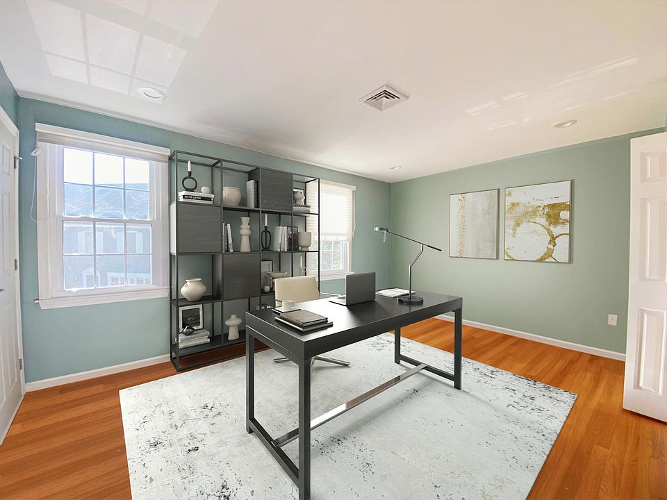 Virtually staged Home office on 3rd floor across from primary bedroom and large bathroom. Access to attic from this room for additional storage