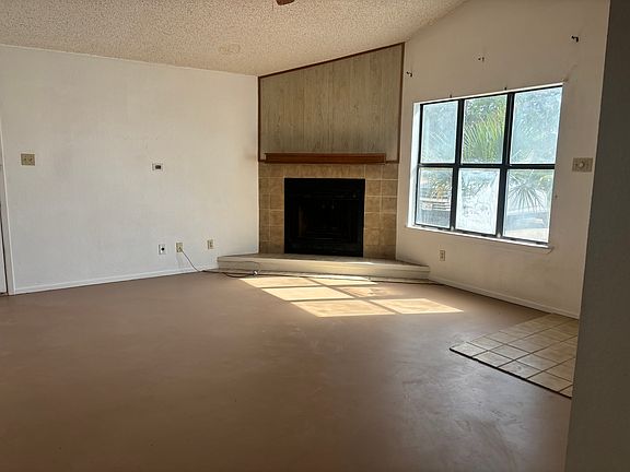 Living room with fireplace & ceiling fan