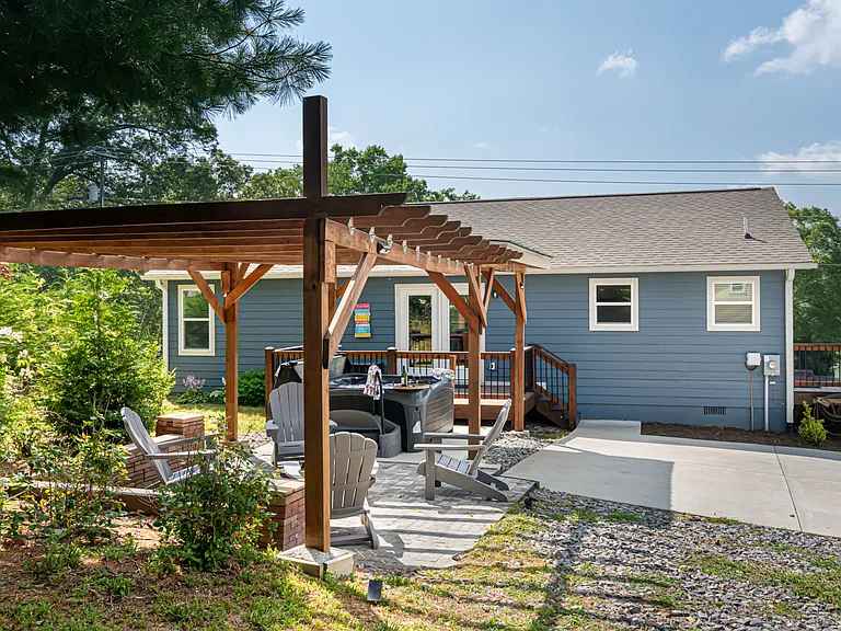 Outdoor Space
 Covered Hot Tub And Fireplace With Pergola