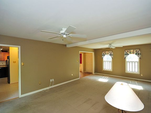 Neutral Colored Walls & 4 Windows complete w/ Plantation Shutters!