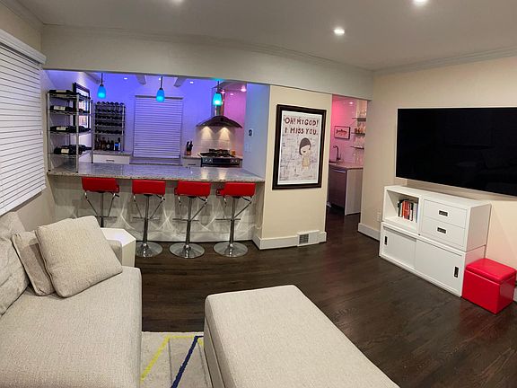 View into the kitchen with HUE smart home light bulbs activated for a custom scene.