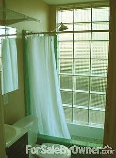 Downstairs Bathroom : Glass block wall in shower - it's like showering outside!