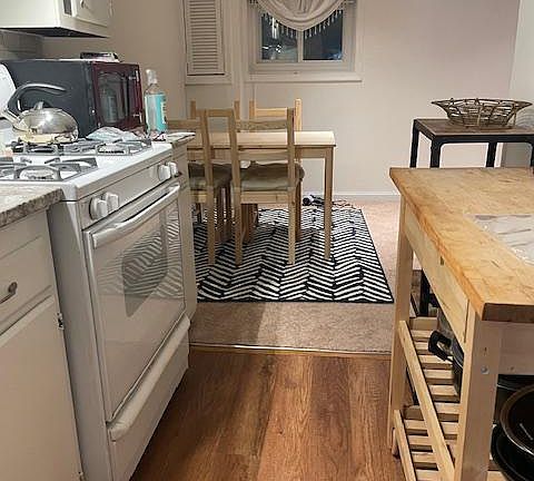 Galley kitchen view into dining area.