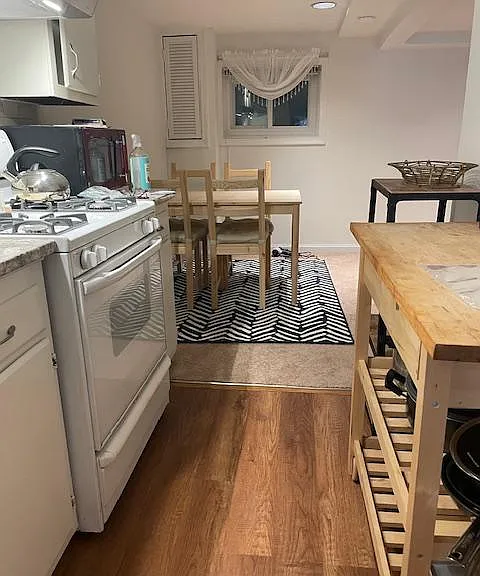 Galley kitchen view into dining area.